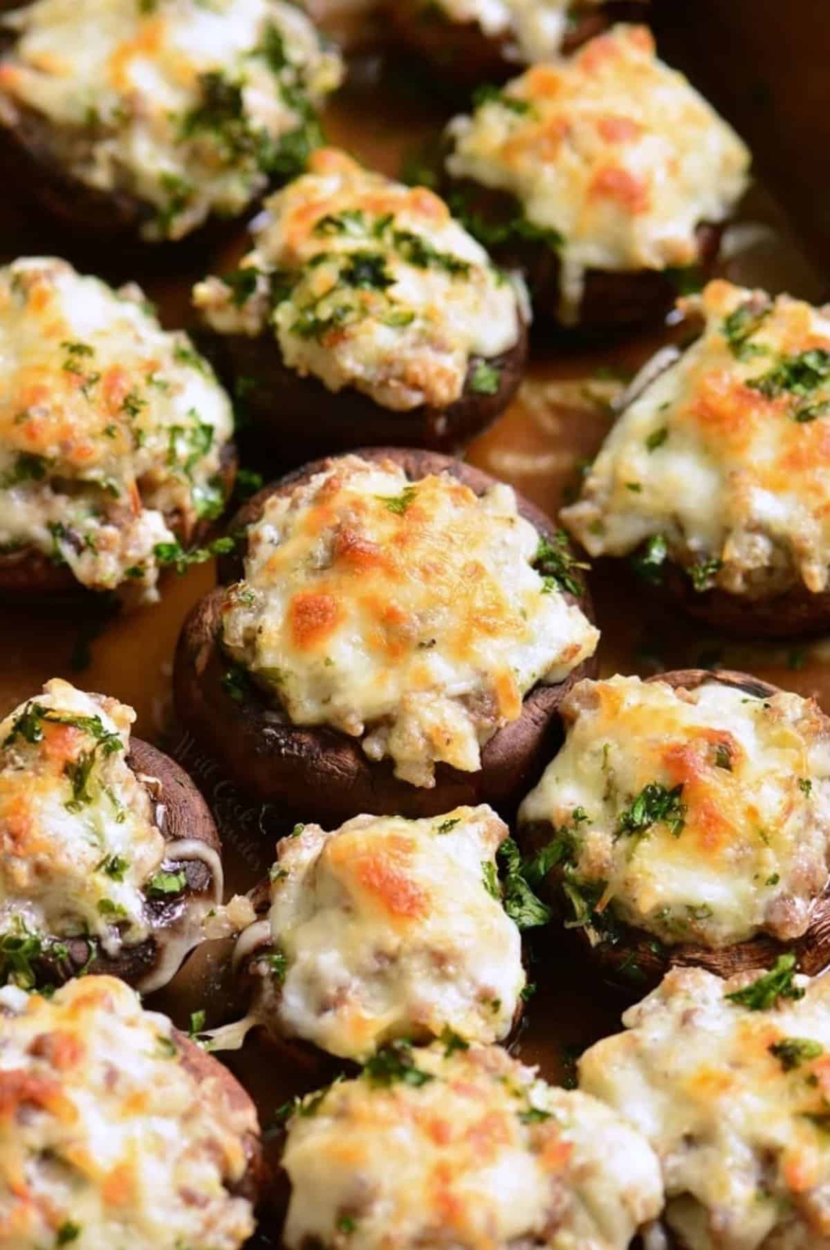 several sausage stuffed mushrooms baked in the baking dish,