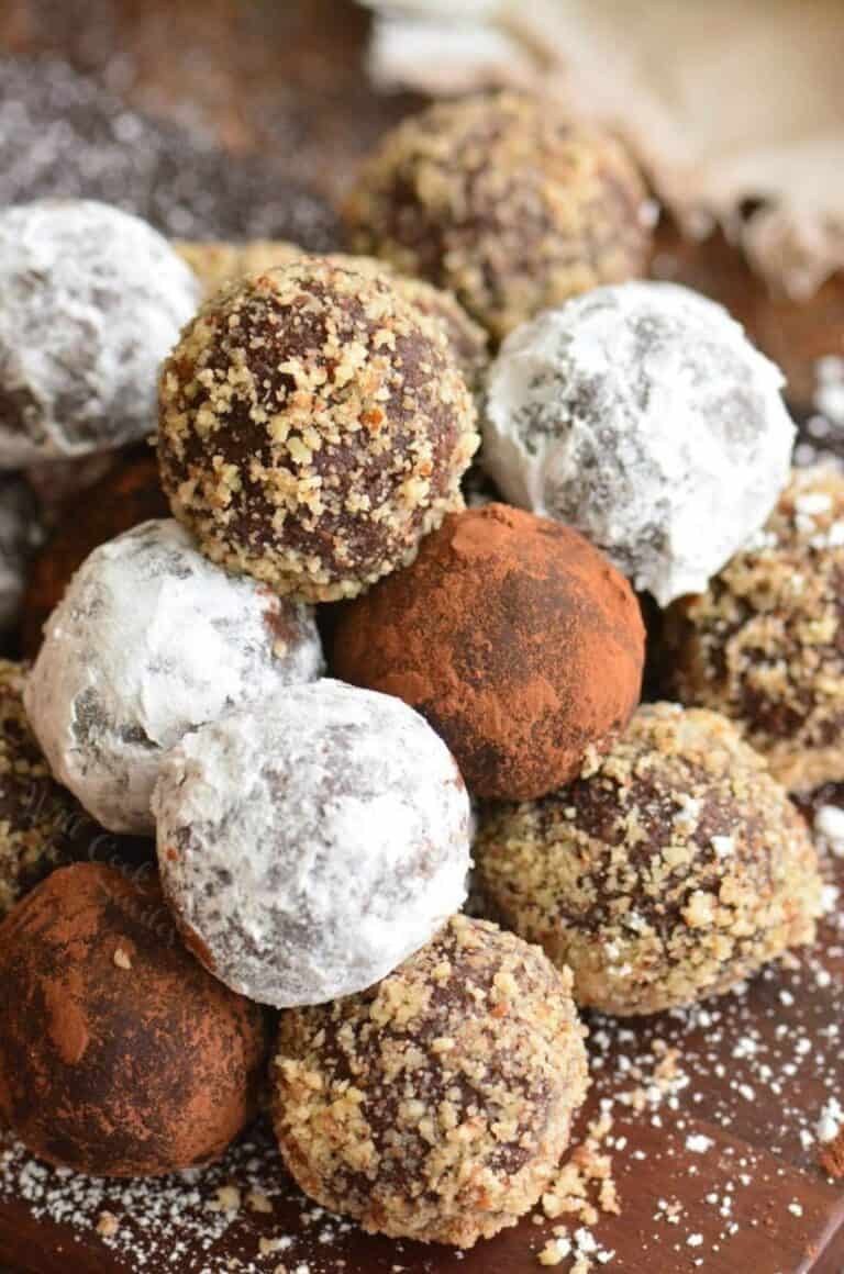 rum balls with three different coatings stacked in a pyramid.