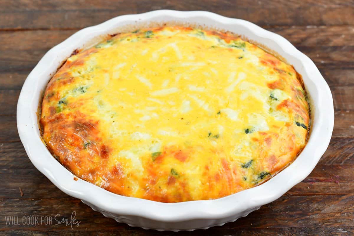 spinach artichoke crustless quiche in the baking dish after baking.