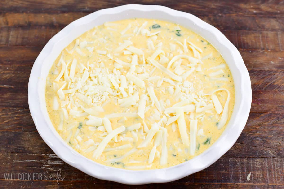 spinach artichoke crustless quiche in the baking dish before baking.