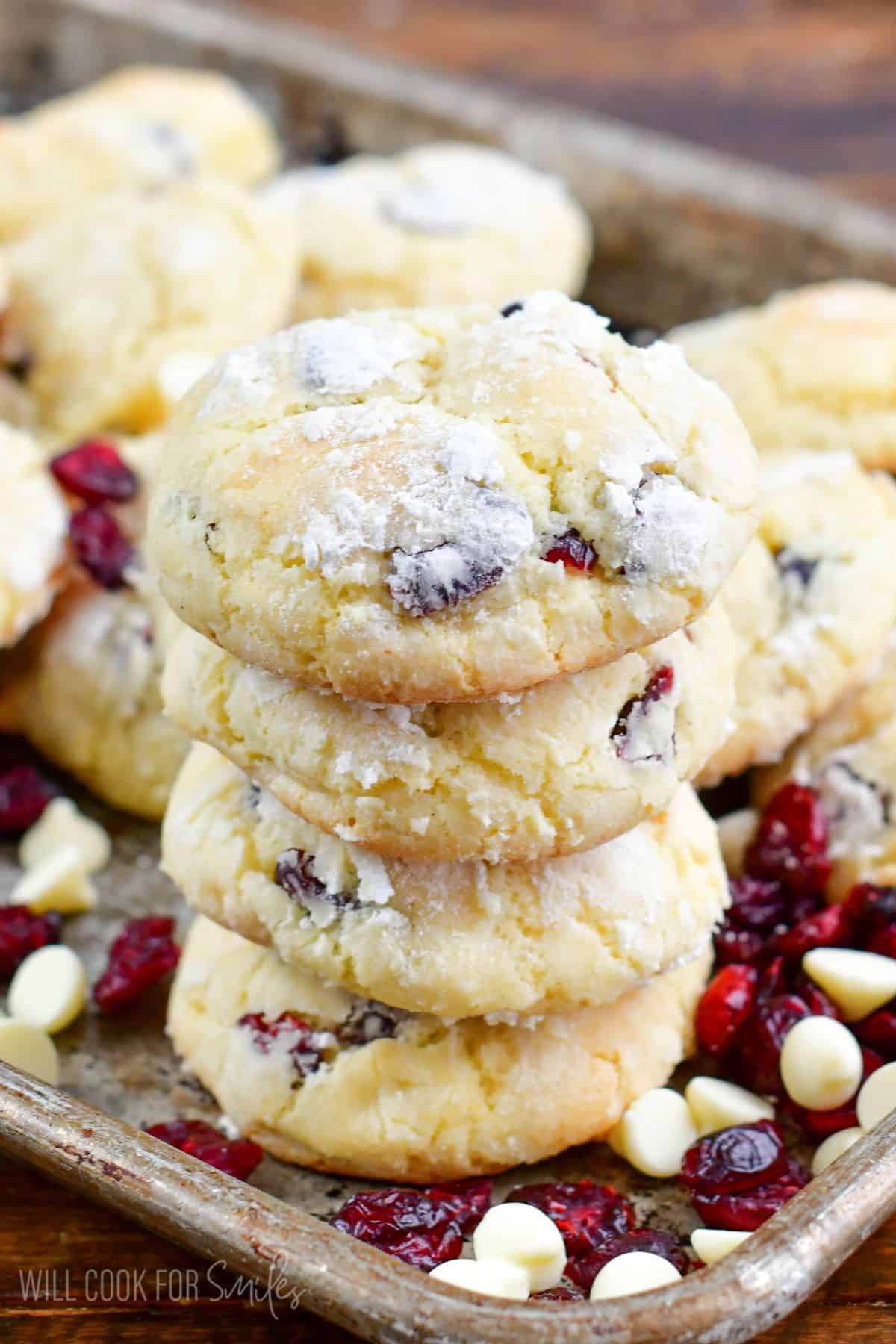 Four White Chocolate Cranberry Cookies stacked in the baking pan.