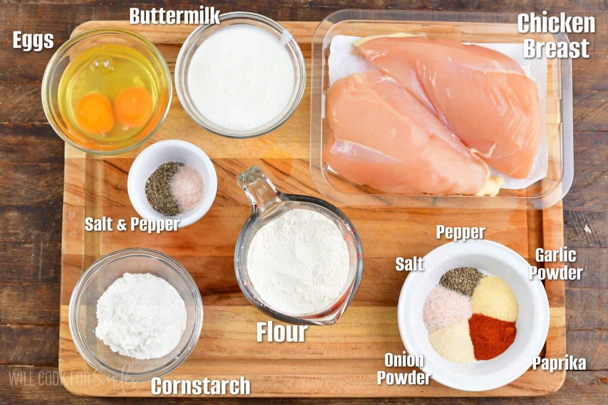 labeled ingredients to make boneless wings in the cutting board.